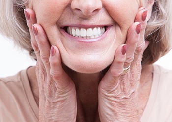 a woman smiling with new dentures